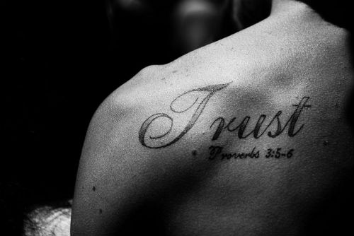 Trust Tattoo On Left Back Shoulder