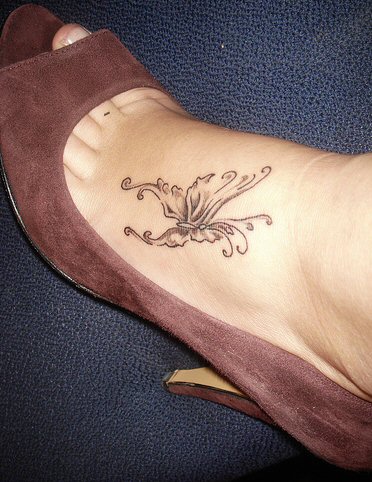 Unique Butterfly Tattoo On Girl Foot