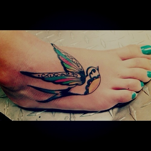 Unique Colorful Bird Tattoo On Girl Foot