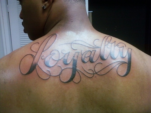 Upper Back Loyalty Tattoo For Men