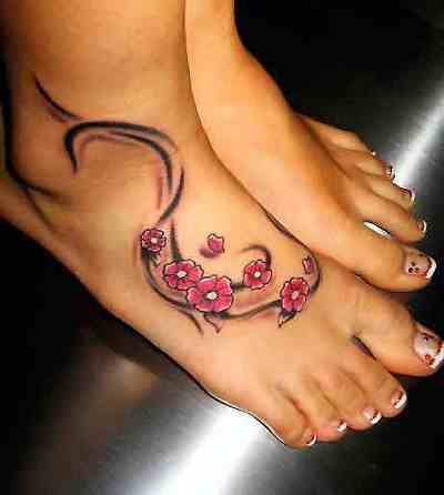 Wonderful Pink Flowers Tattoo On Girl Foot