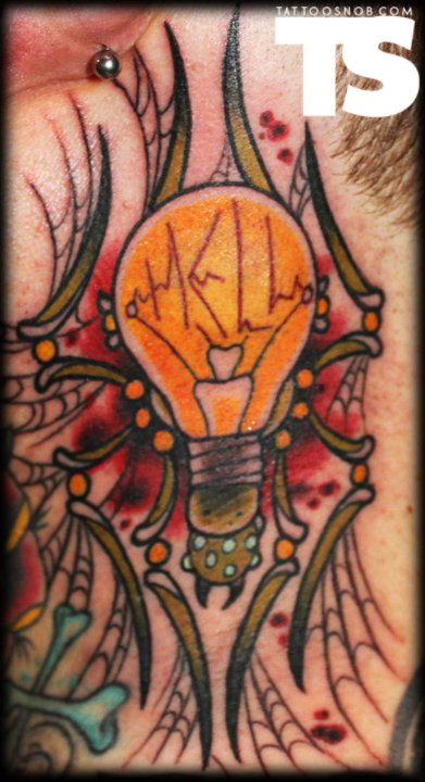 Yellow Bulb Tattoo On Chest