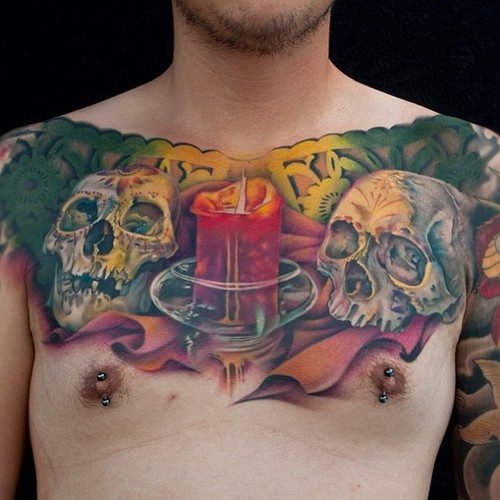 Attractive 3D Candle With Two Skulls Tattoo On Man Chest