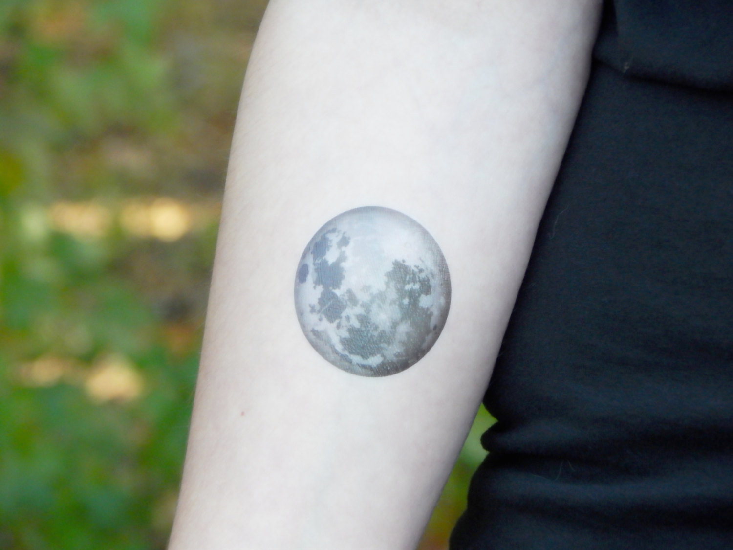 Black And Grey Moon Tattoo On Forearm.