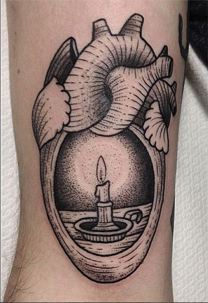Black Ink Burning Candle In Real Heart Tattoo Design