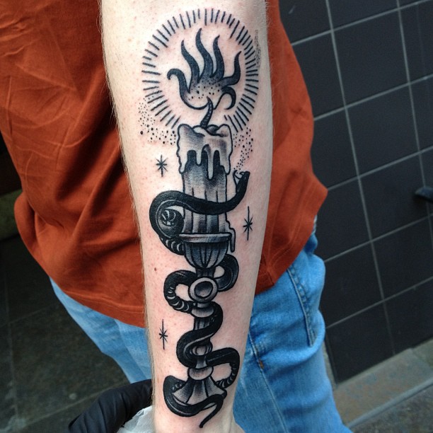 Black Ink Burning Candle Lamp With Snake Tattoo On Forearm