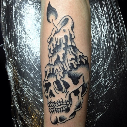 Black Ink Burning Candle On Skull Tattoo Design For Forearm