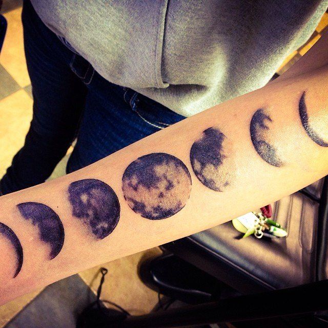 Black Ink Moons Tattoo On Forearm