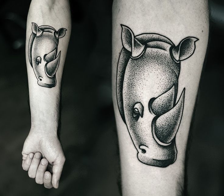 Black Ink Rhino Head Tattoo On Forearm