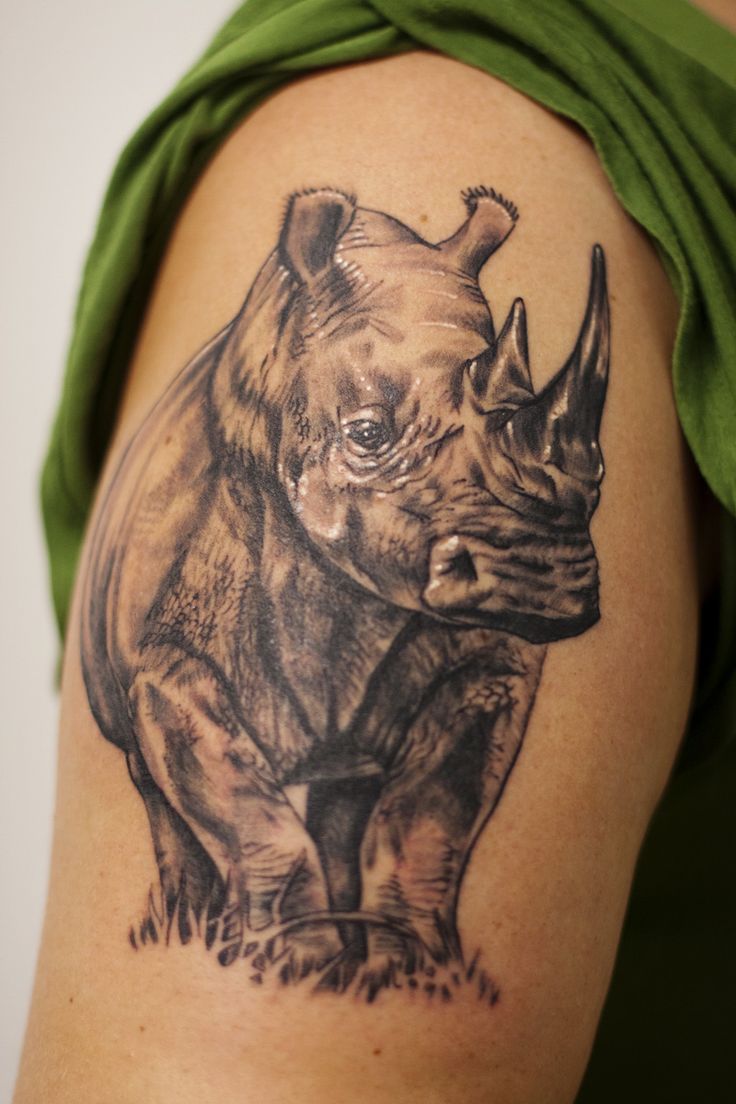 Black Ink Rhino Tattoo Design For Shoulder