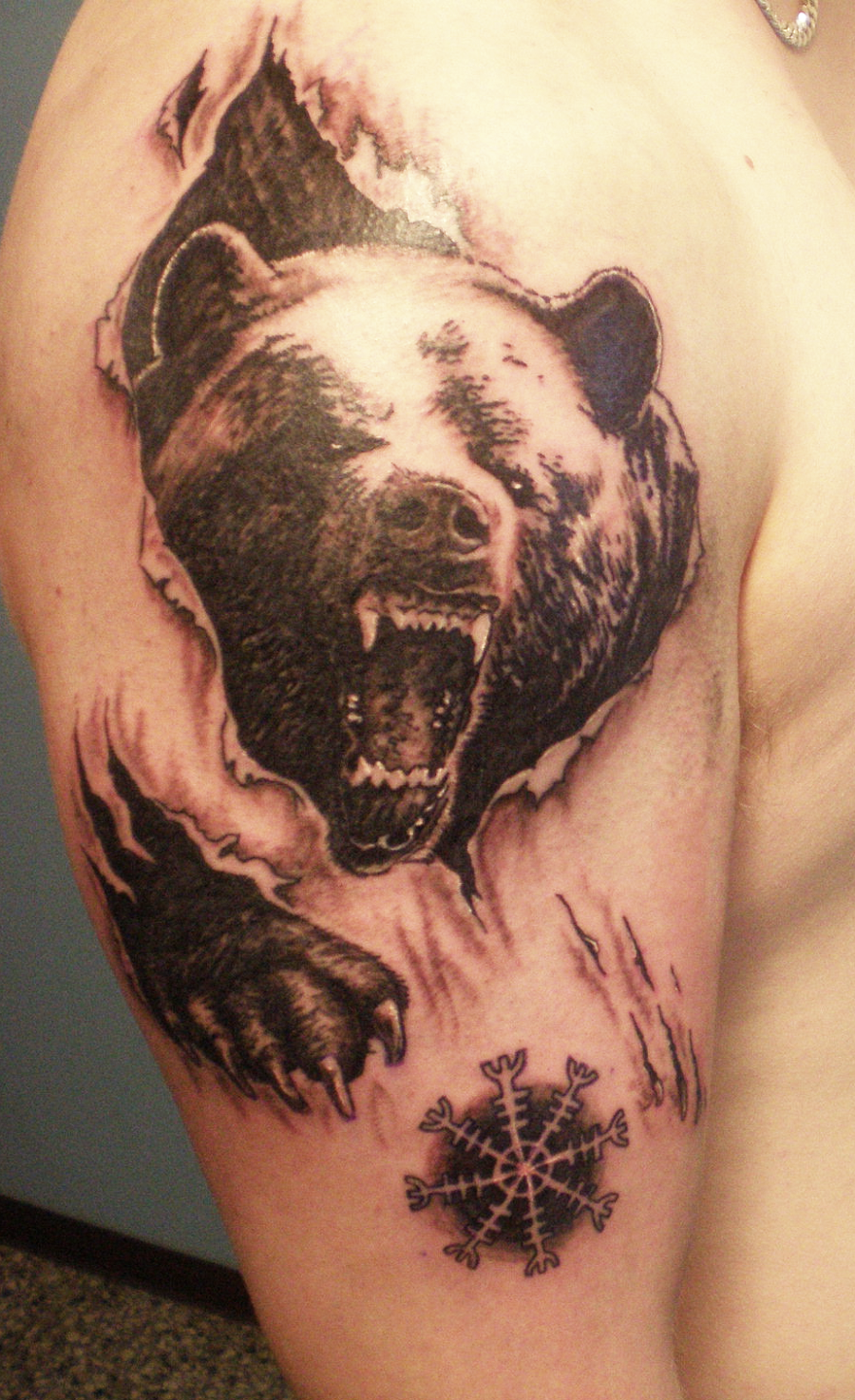Black Ink Ripped Skin Bear Tattoo On Right Shoulder