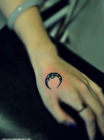 Black Little Tribal Half Moon Tattoo On Girl Hand