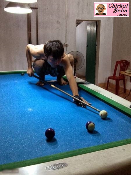 Boy Playing Snooker In Funny Way