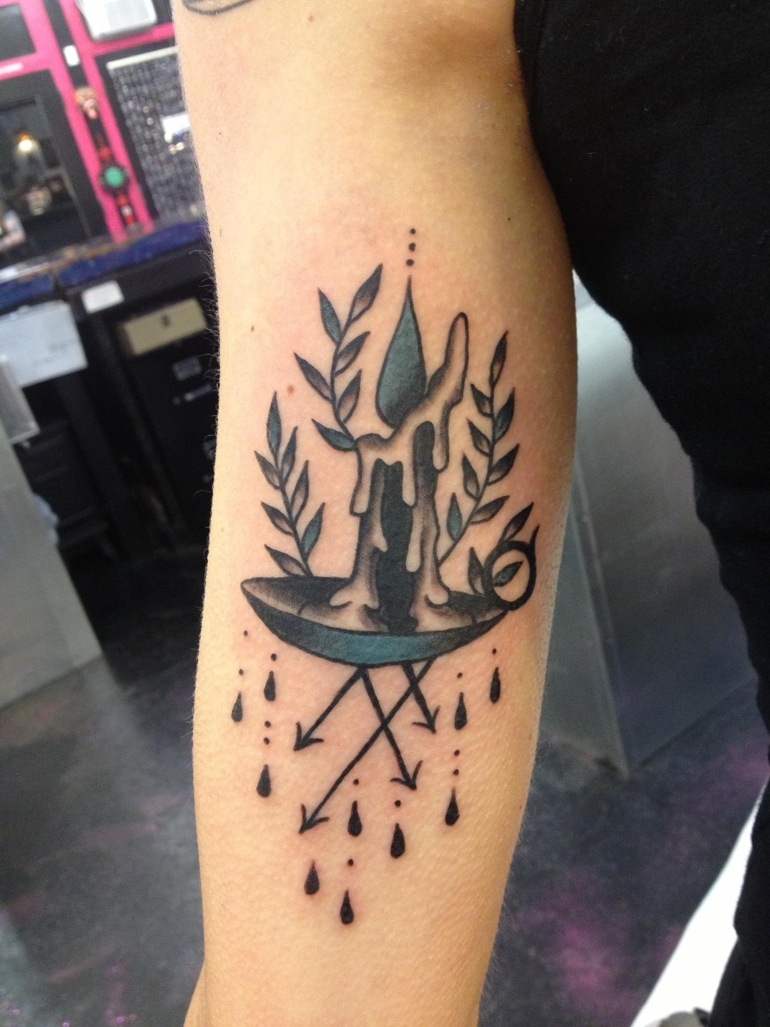 Burning Candle In Holder Tattoo On Bicep