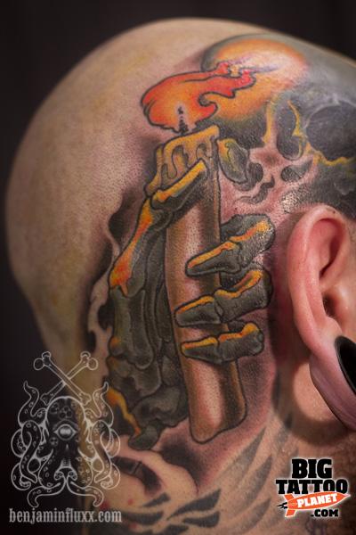 Candle In Skeleton Hand Tattoo On Head