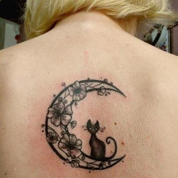 Cat On Half Moon With Flowers Tattoo On Girl Upper Back