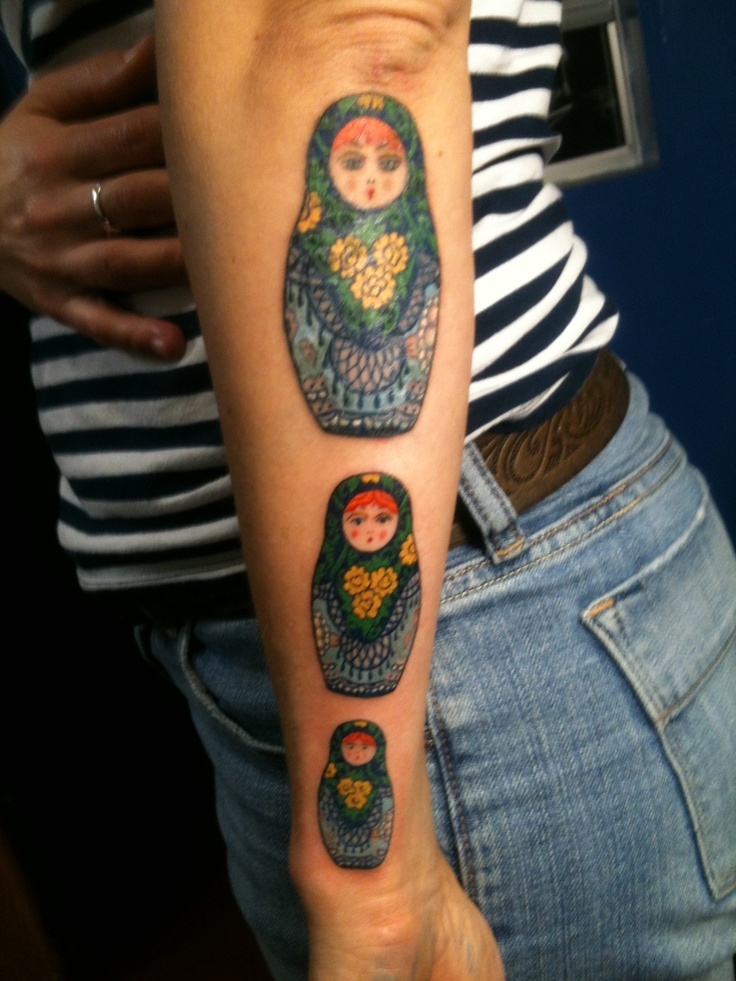 Colored Matryoshka Tattoos On Girl Left Sleeve