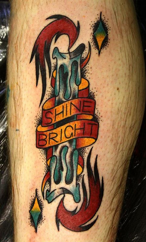 Colorful Burning Candle With Banner Tattoo On Leg