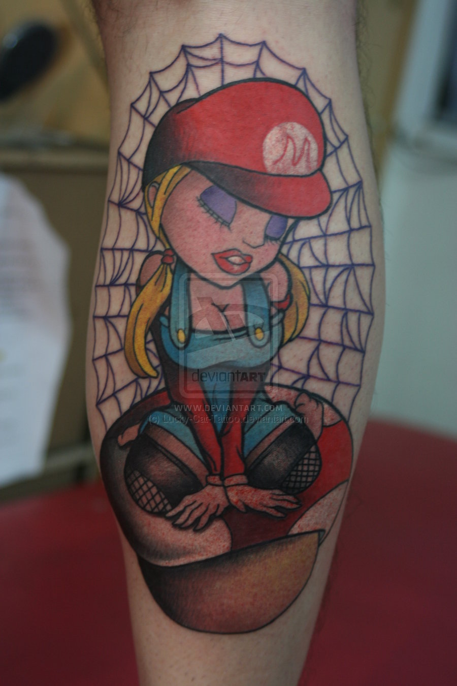 Evil Girl On Mushroom Tattoo On Back Leg