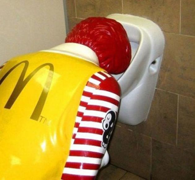 Funny McDonald Clown Statute Vomiting In Toilet
