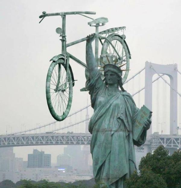 Funny Statue Of Liberty Lifting Bicycle