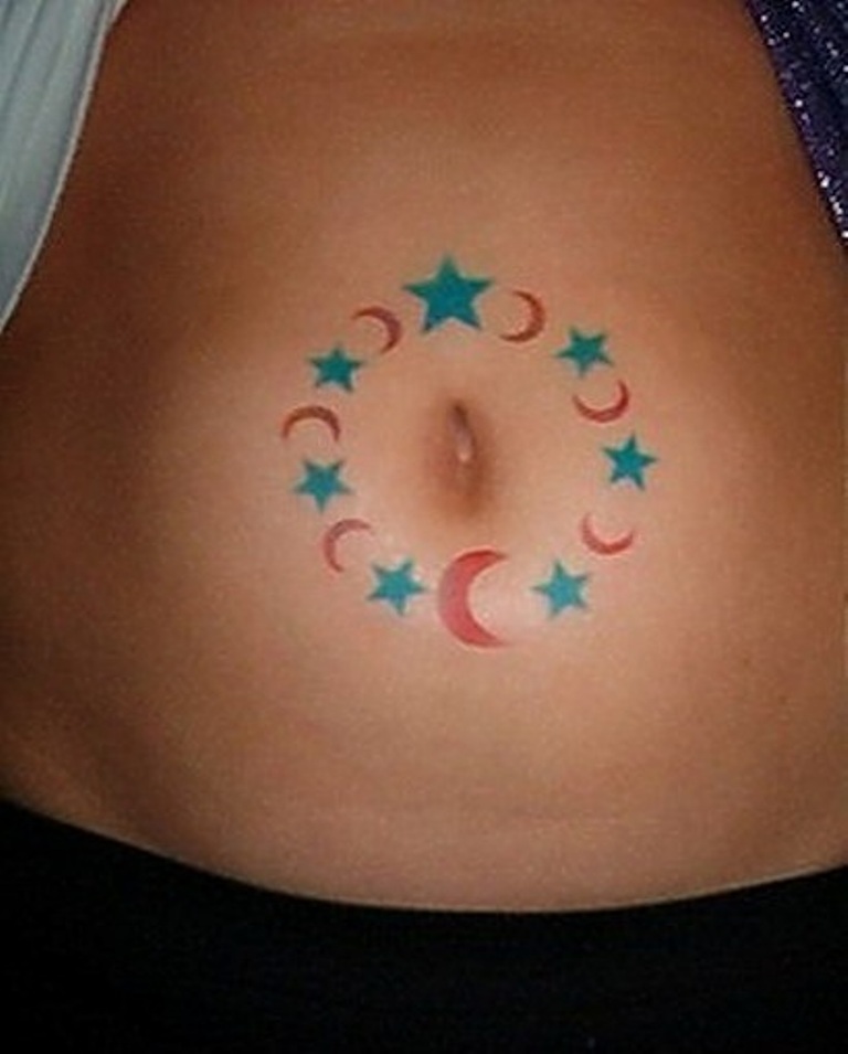 Green And Red Half Moons And Stars Tattoo On Belly Button