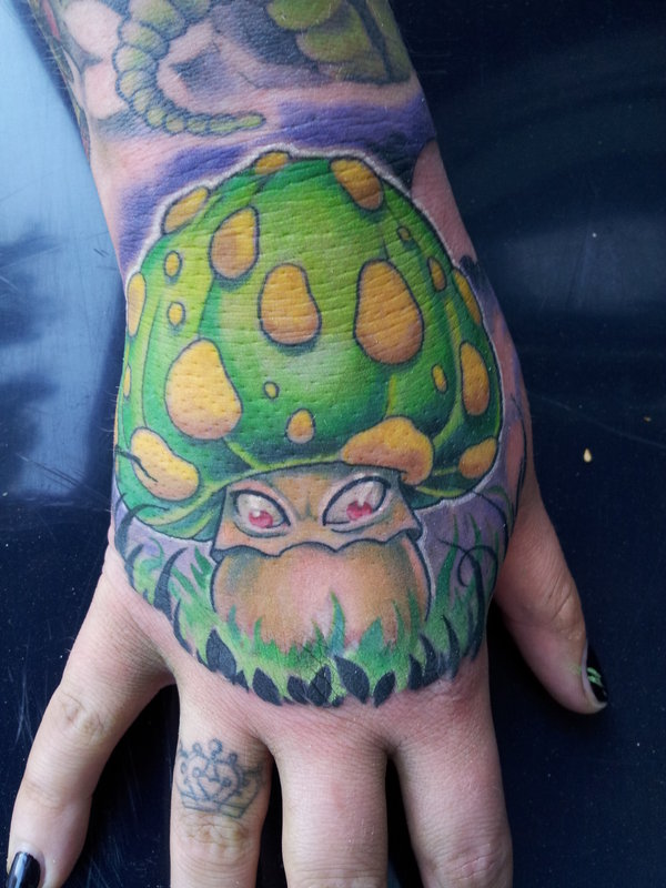Green Evil Mushroom Tattoo On Hand by Mojoncio