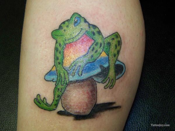 Green Frog Sit On Evil Mushroom Tattoo On Leg