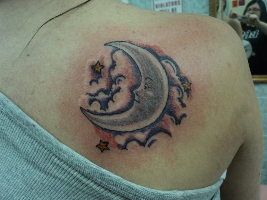 Half Moon Face With Stars Tattoo On Right Back Shoulder