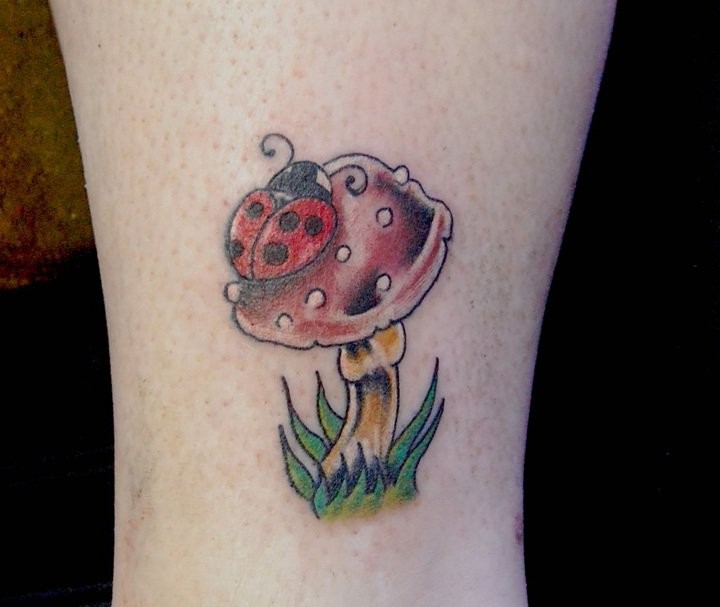 Ladybug On Mushroom Tattoo Closeup Image
