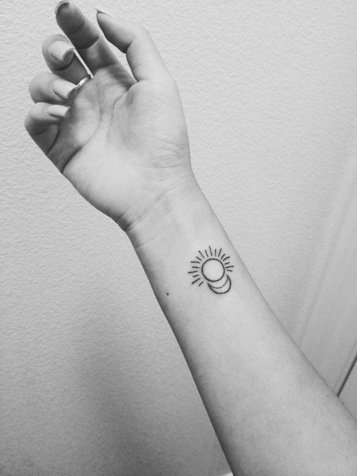 Little Black Sun With Half Moon Tattoo On Girl Wrist
