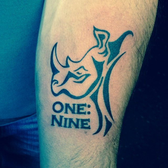 One Nine - Black Tribal Rhino Head Tattoo Design For Arm
