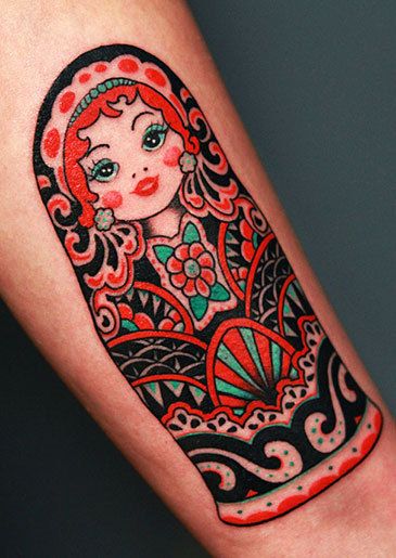 Red And Black Matryoshka Tattoo On Sleeve