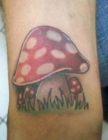 Red Ink Evil Mushroom Tattoo On Arm