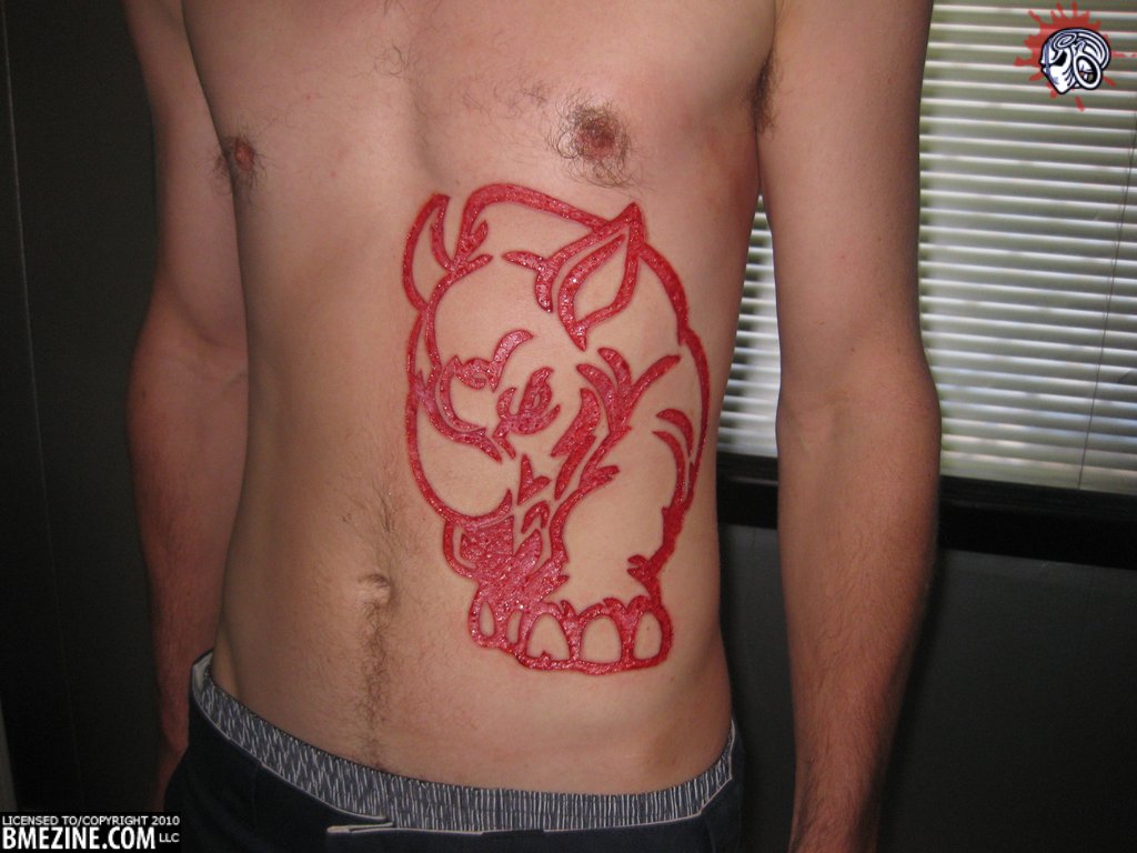 Red Outline Rhino Tattoo On Man Stomach
