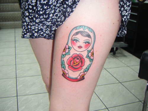 Red Rose In Matryoshka Doll Tattoo On Left Thigh