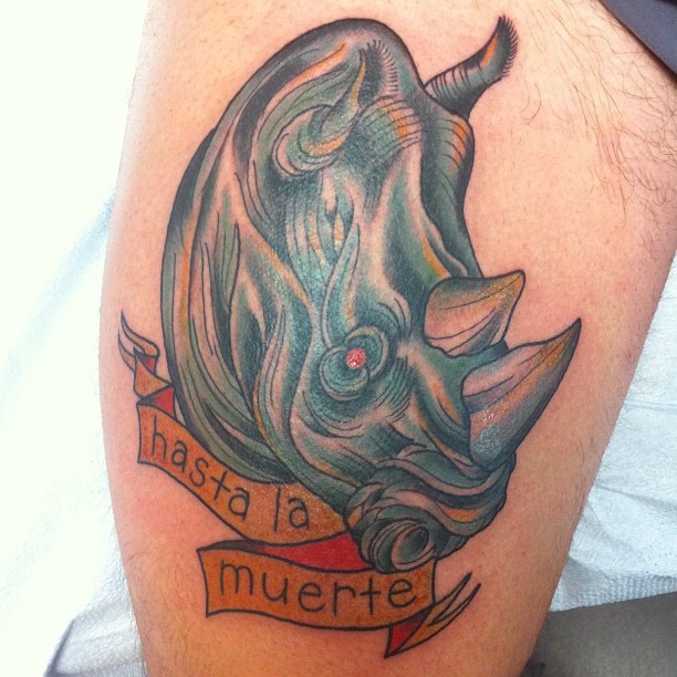 Rhino Head With Banner Tattoo Design For Thigh