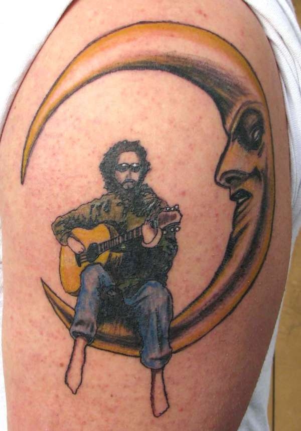 Rockstar Playing Guitar On Half Moon Tattoo On Shoulder
