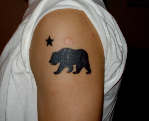 Silhouette Bear With Star Tattoo On Left Shoulder