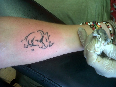 Simple Black Rhino Tattoo On Forearm
