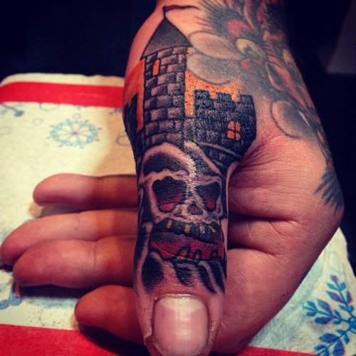 Skull With Castle Tattoo On Thumb