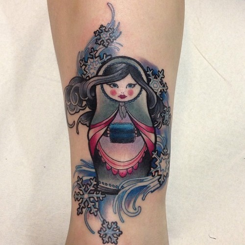 Snow Flakes And Matryoshka Tattoo On Arm