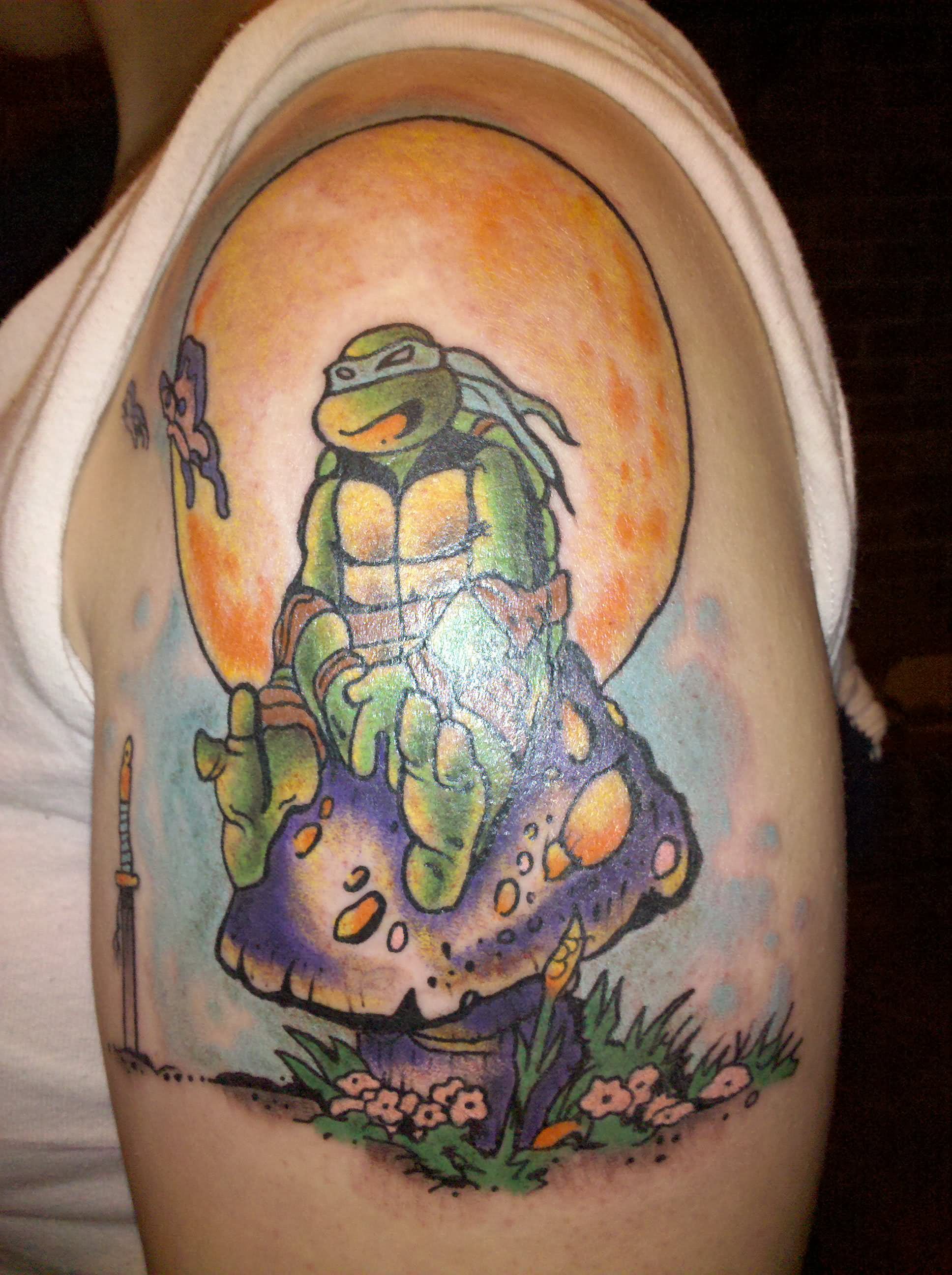 Turtle Sit On Mushroom Tattoo On Left Shoulder