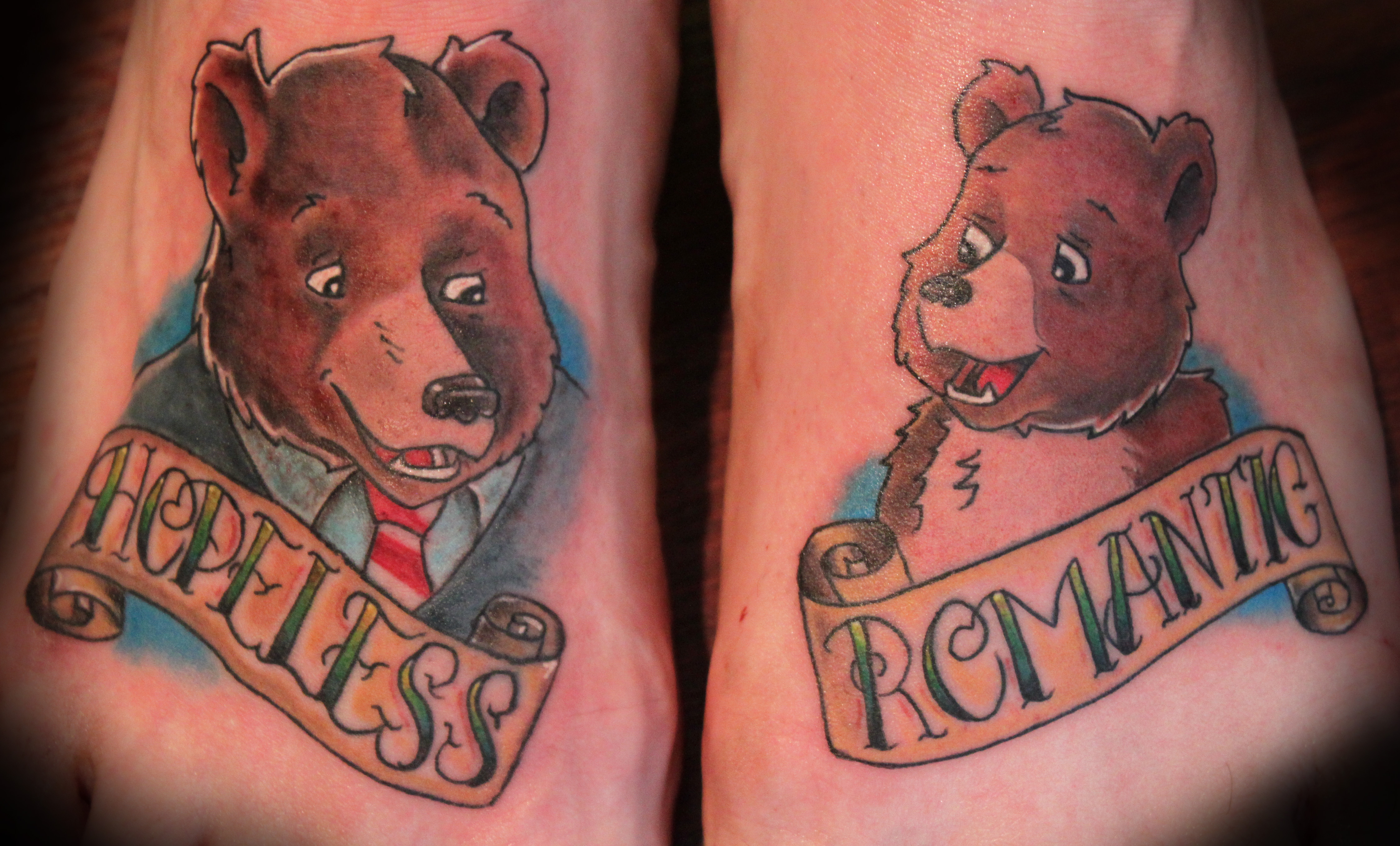Two Cartoon Bear With Banner Tattoo On Feet