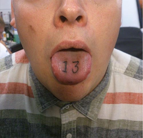 13 Number Tattoo On Man Tongue