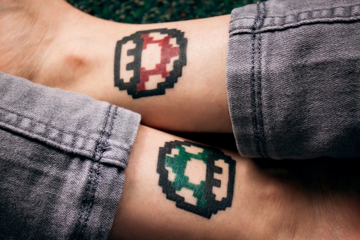 Animated Green And Red Mario Mushroom Tattoos On Legs