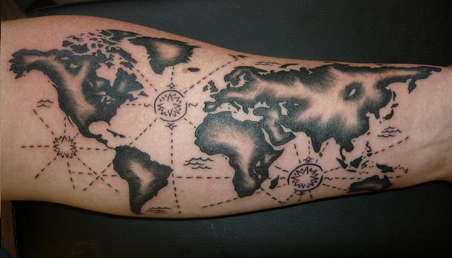 Awesome Black Ink World Map Tattoo On Forearm