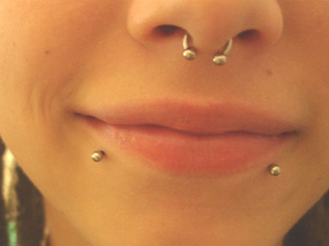 Beautiful Girl With Septum And Lower Lip Piercings