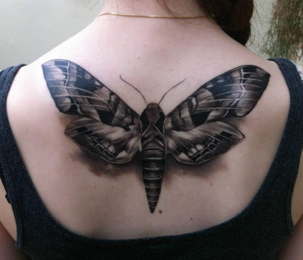 Black And Grey 3D Moth Tattoo On Girl Upper Back