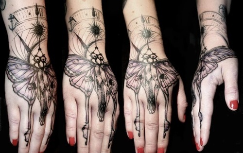 Black And Grey Moth Tattoo On Girl Hand